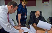 Image of staff working on paperwork